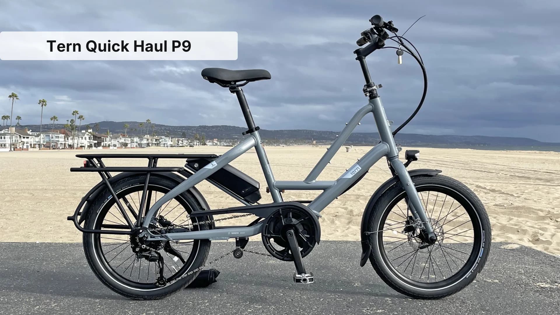 Tern Quick Haul P9 compact cargo e-bike with extended rear rack in urban setting