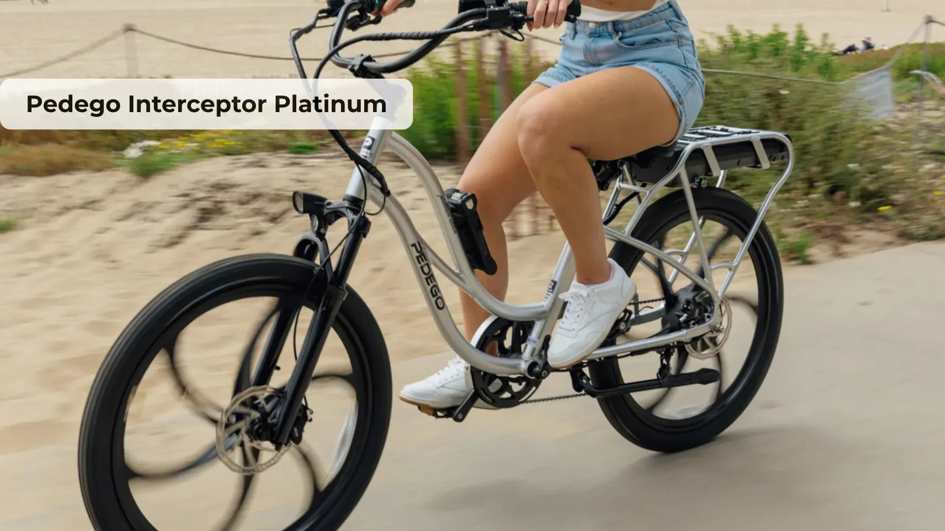 Pedego Interceptor Platinum electric cruiser bike in classic beach cruiser style with wide swept-back handlebars