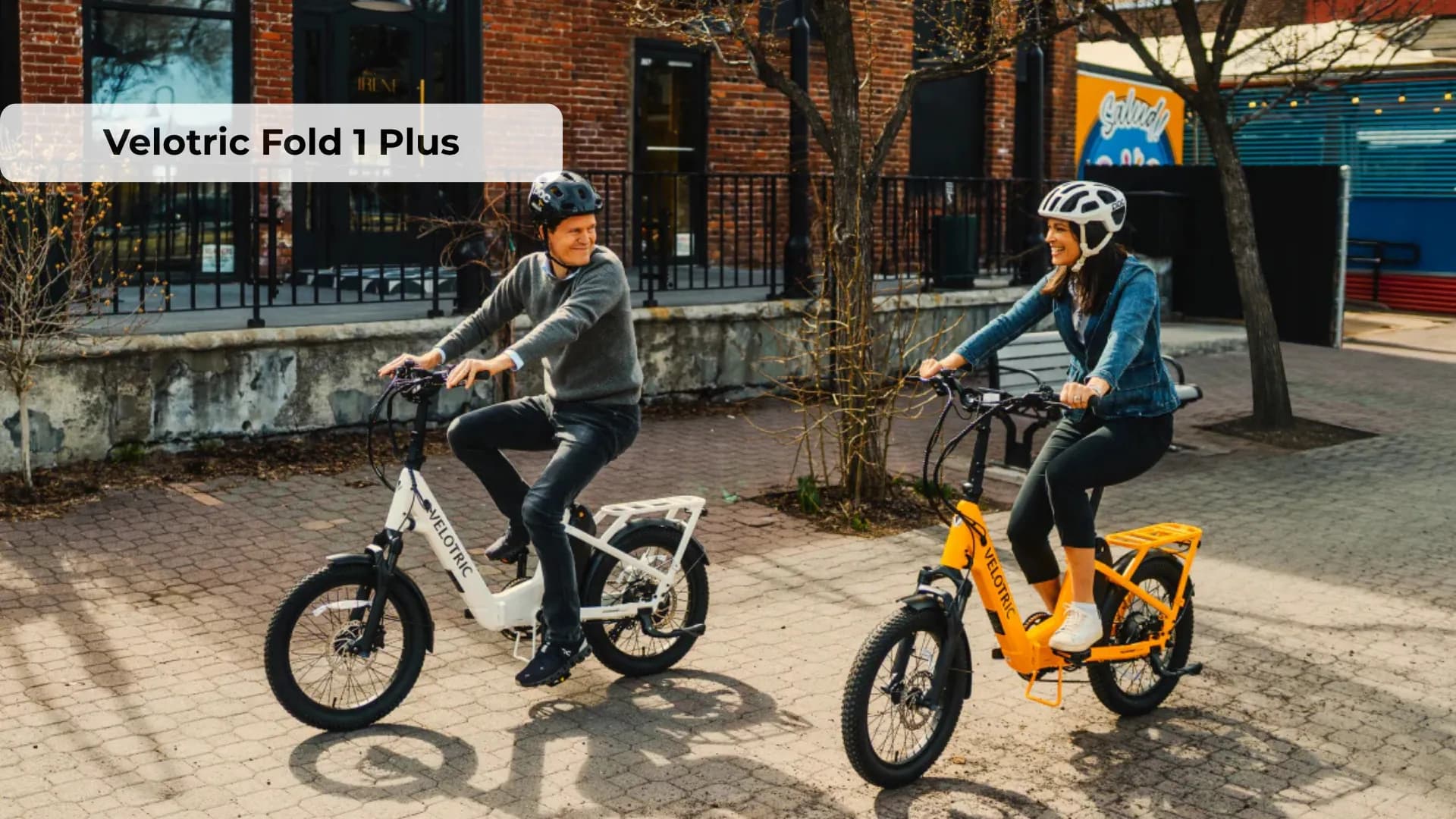 Velotric Fold 1 Plus folding electric bike shown in Mango color with 20-inch fat tires