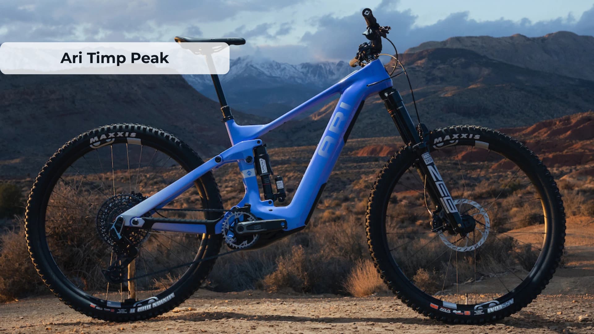 Ari Timp Peak 2.0 electric mountain bike on mountain trail showing carbon frame and Bosch motor