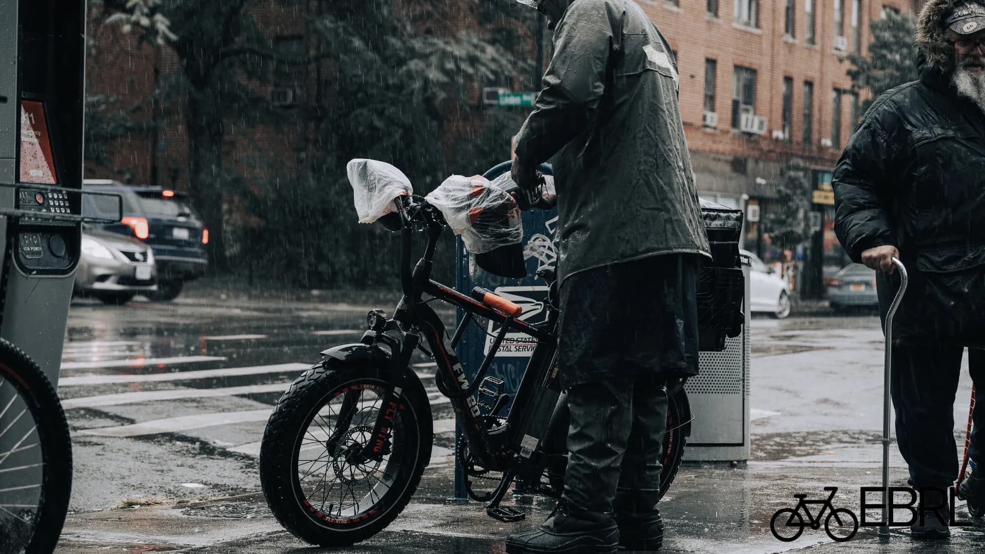Electric bike ridden through light rain on a wet city street