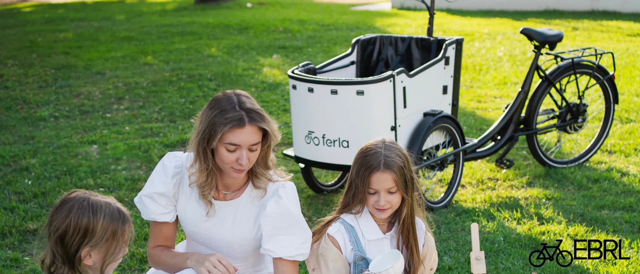 Ferla Royce II electric cargo bike with family cargo box and three-wheel frame