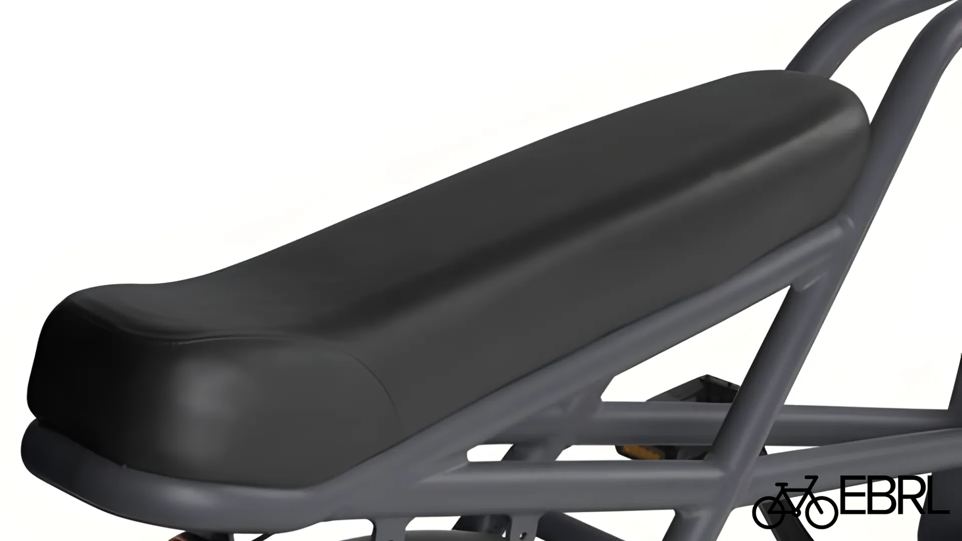 Person riding Retrospec Valen Rev+ on coastal path showing comfort and posture