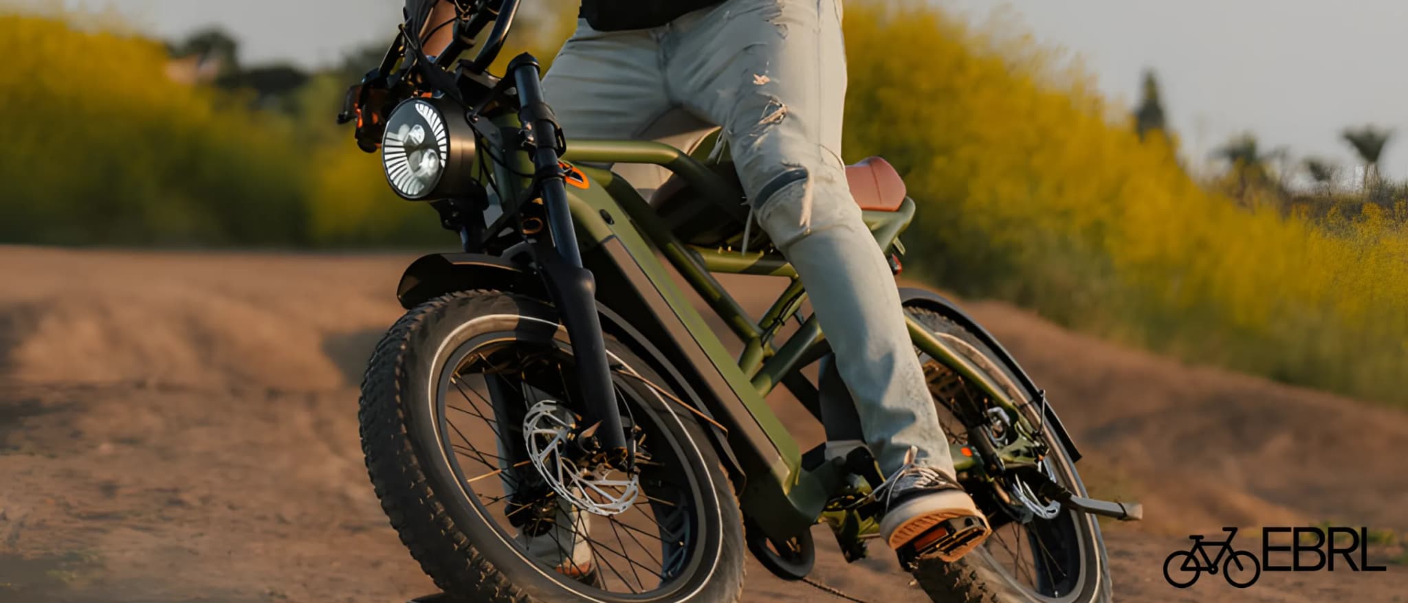 Retrospec Valen Rev+ Fat Tire Electric Bike in Matte Olive Drab on a coastal path