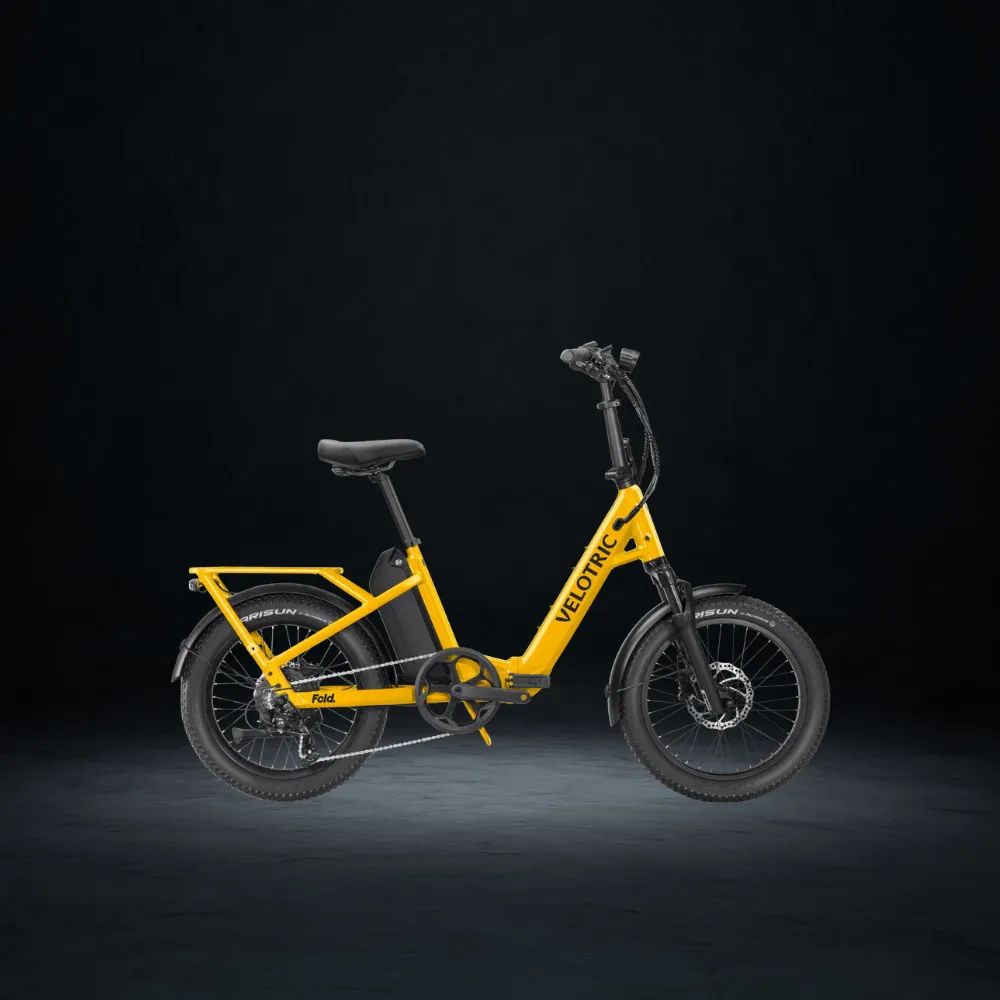 Velotric Fold 1 Plus folding ebike in Mango colorway on city street